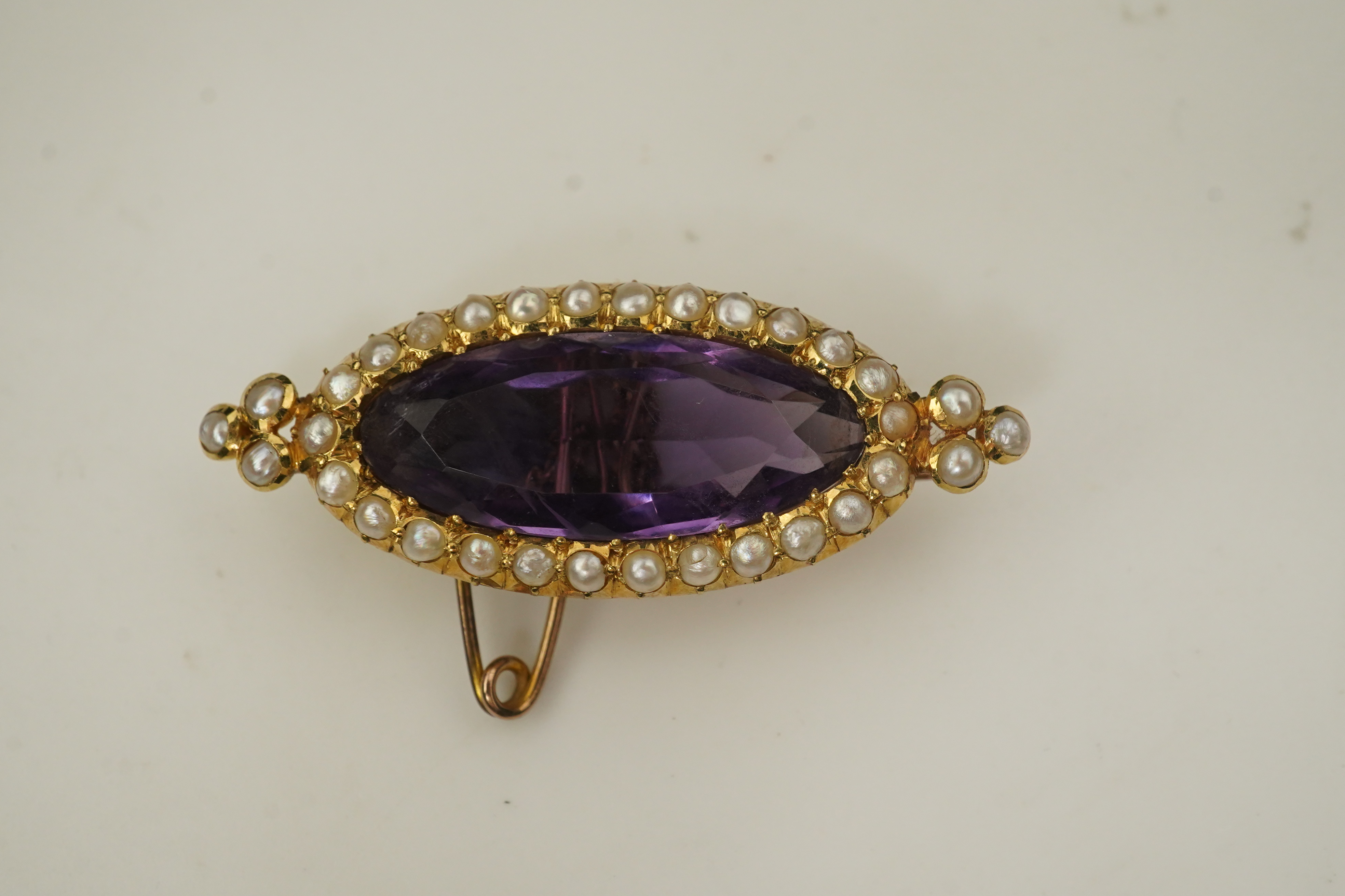 An amethyst and pearl brooch, circa 1900